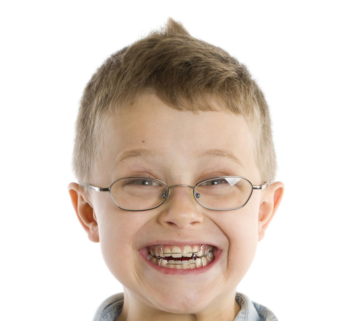 8 years old boy with braces on white background.