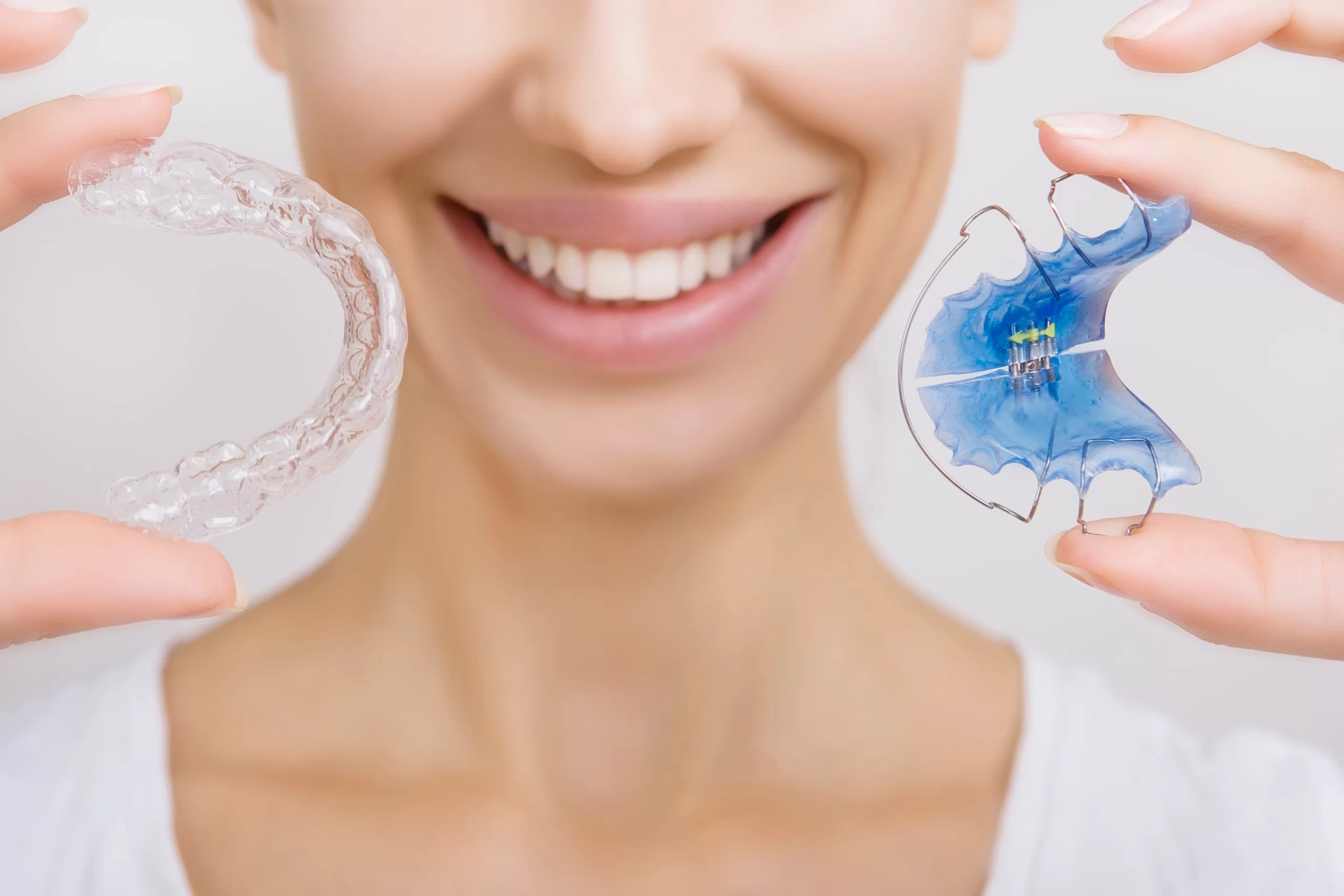 Close-up of dental retainers and orthodontic appliances for teeth alignment